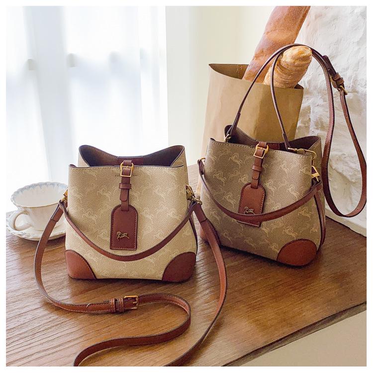 Трендовая сумка-тоут для通勤 2025: Модная сумка-ведро через плечо и на плечо