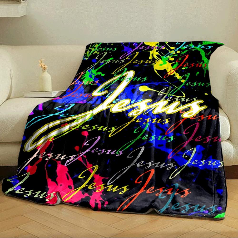 Colorful splatter background with repeating "Jesus" text in cursive style. for all seasons blanket lunch break throw gift
