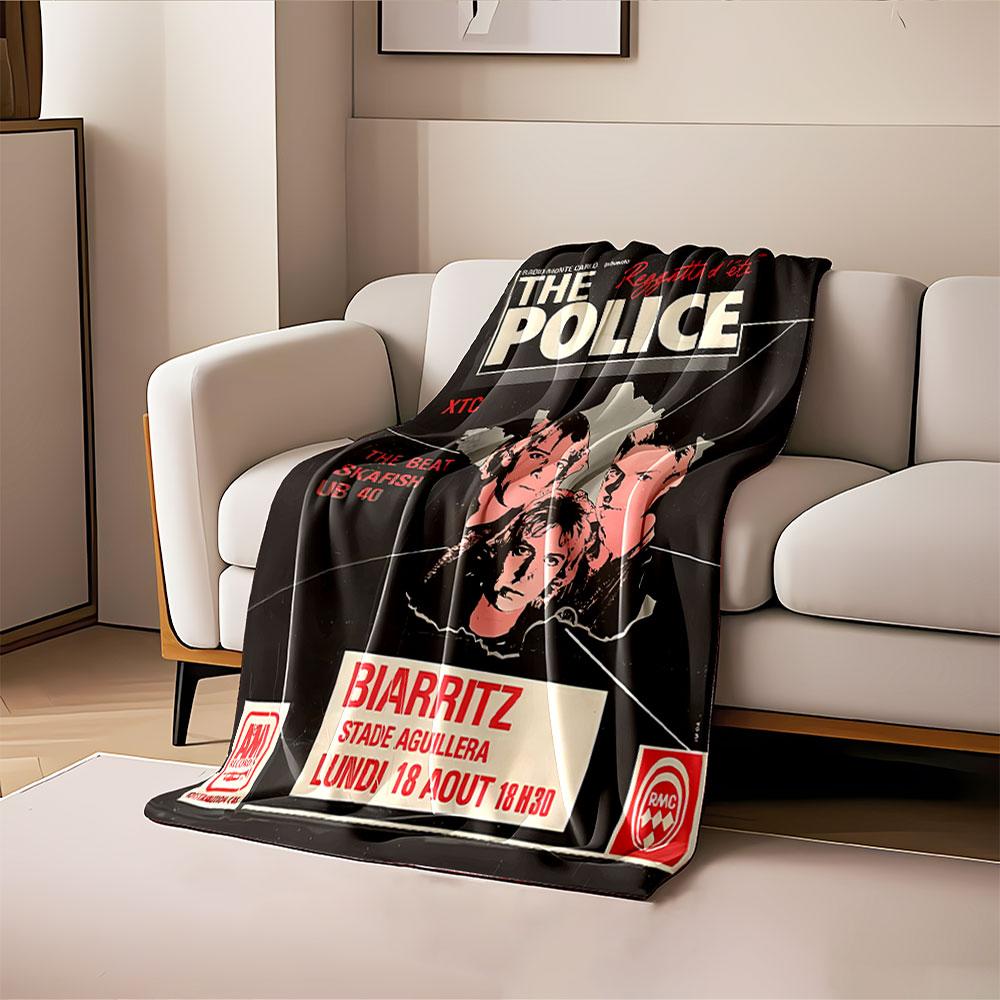 A retro-style concert poster with red, black, and white text and visuals. for all seasons blanket lunch break throw gift