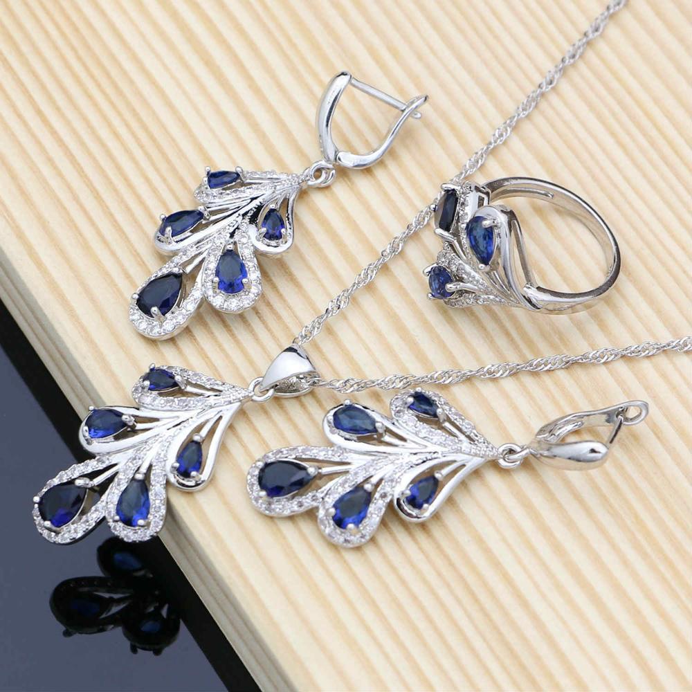 Серебристый ювелирный комплект с синими кристаллами: браслет + ожерелье + серьги + кольцо