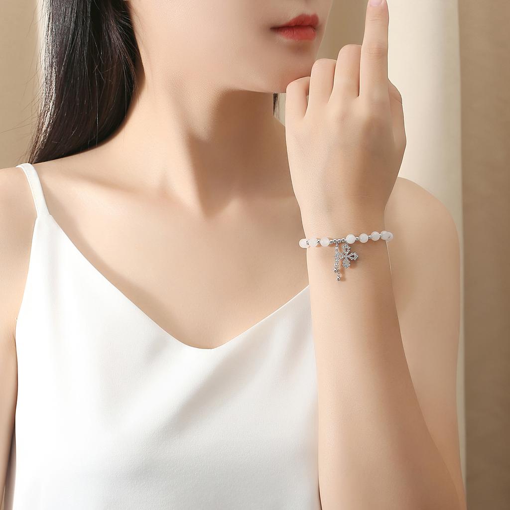 Light Luxury Style Full Diamond Four-leaf Clover and Field Jade Bracelet S925 Silver Inlaid with Diamonds and Zircon Leaf Jewelry Tassel Ball Jewelry