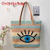 Large Woven Raffia Beach Bag With Eye Print Design And Dual Shoulder Straps For Vacation