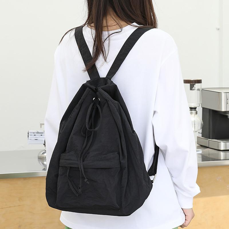 IELGY Korean Version of Casual Literary Canvas Backpack, Fashionable Nylon Solid Color Small Fresh Drawstring Backpack