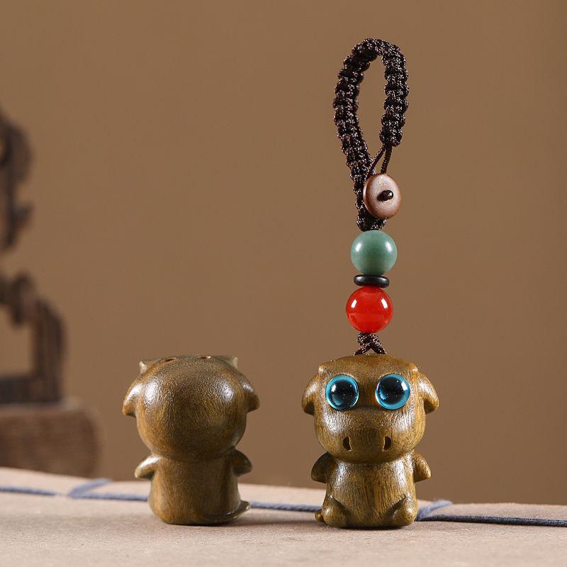 Twelve Zodiac Animal Charms Green Sandalwood Set: Rat, Ox, Tiger, Rabbit, Dragon, Snake, Horse, Sheep, Monkey, Rooster, Dog, Pig.