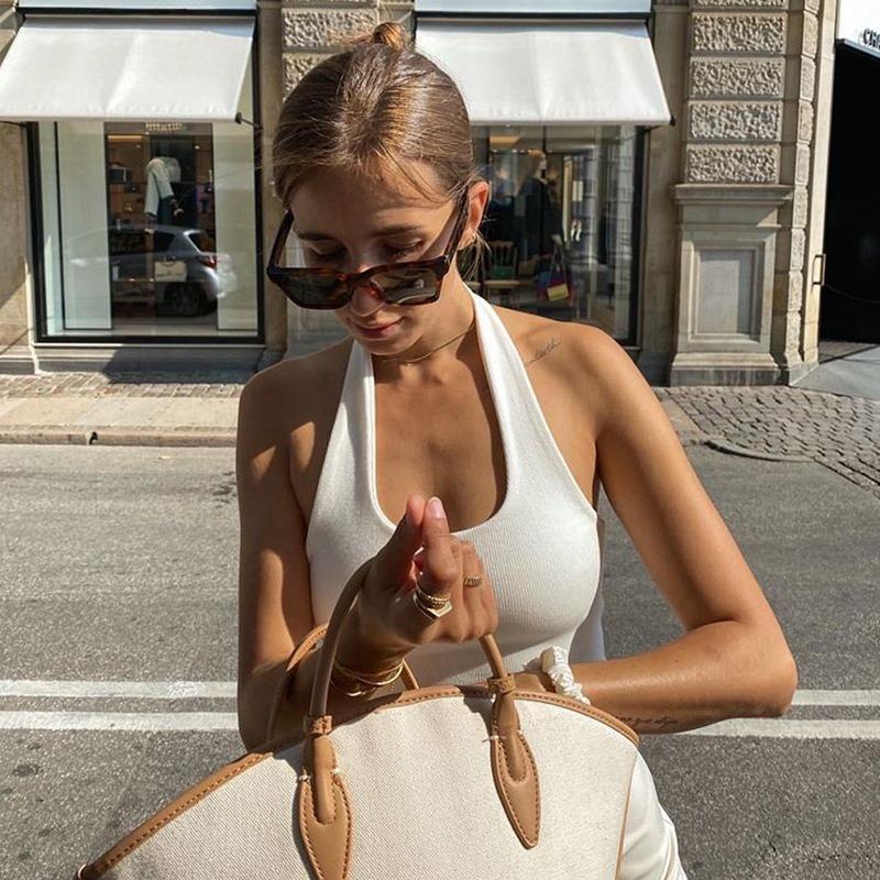 Летние новые сексуальные укороченные топы без рукавов для женщин с бретелькой через шею и открытой спиной, облегающие базовые топы, женские жилеты, модные ребристые однотонные женские повседневные майки 24683