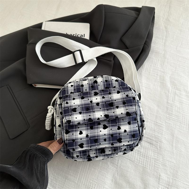 Niche design plaid bag women's 2025 autumn new trendy shoulder messenger bag feeling versatile commuter saddle bag