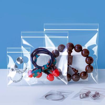 StoBag 100 шт. Прозрачные пакеты для упаковки ювелирных изделий из полипропилена, самозапечатывающиеся, маленькие, прозрачные, для хранения серег и браслетов, многоразовые мешочки