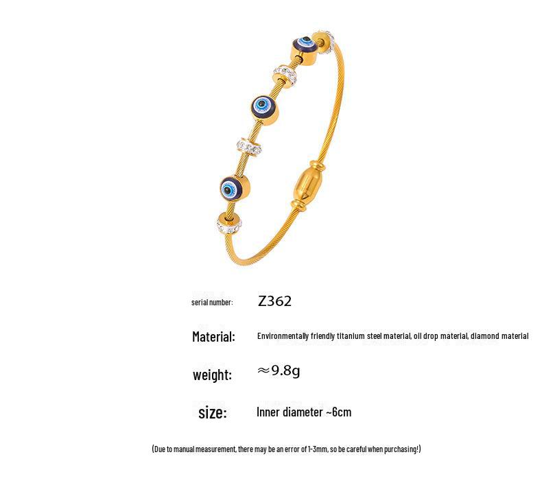 Браслет из титановой стали с 18-каратным золотом и бриллиантами от «дурного глаза»