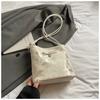 Korean niche bow women's bag 2025 new summer shoulder armpit bag fashionable high-value portable bucket bag
