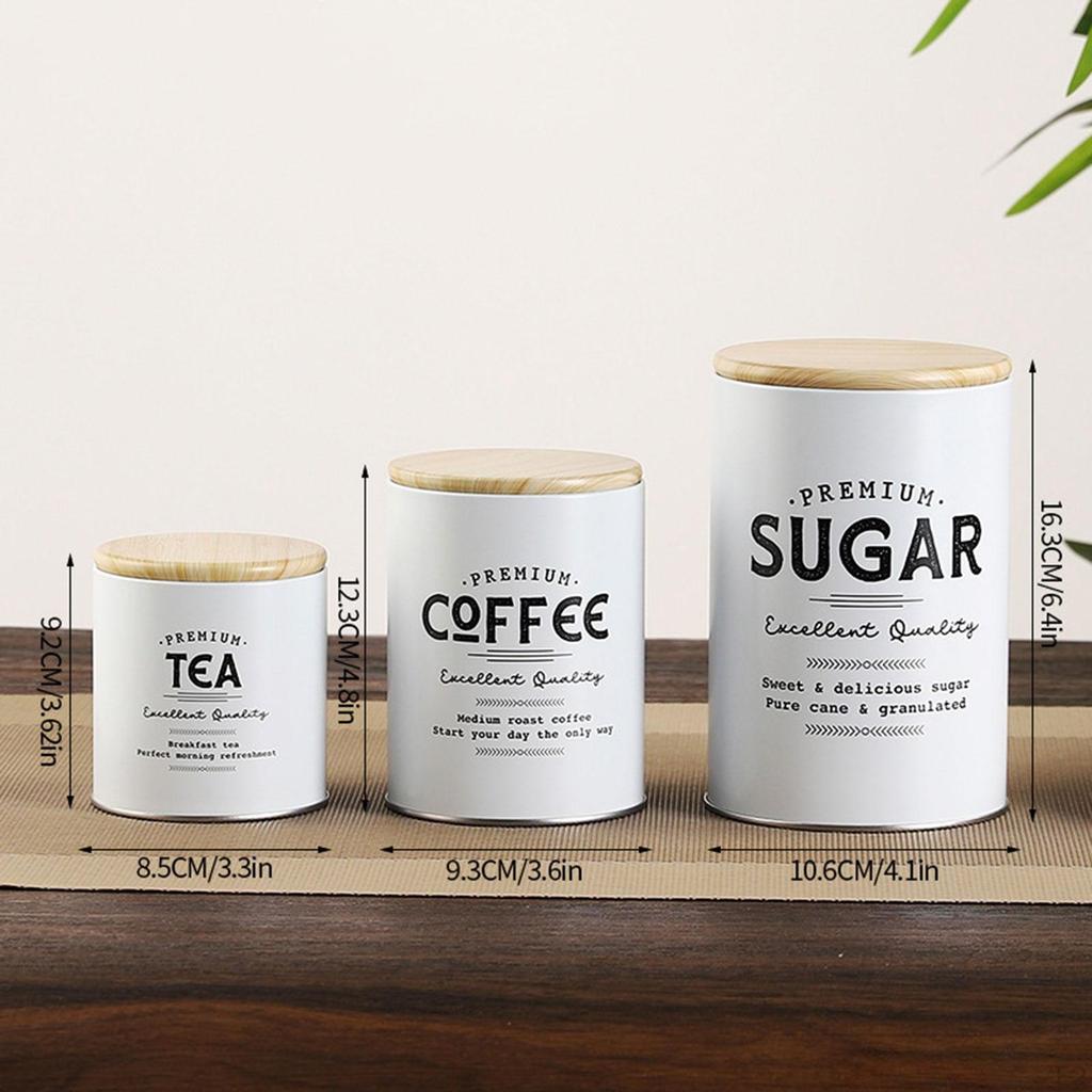 Композиция из 3 банок для хранения кофе, чая и сахара на кухонной столешнице