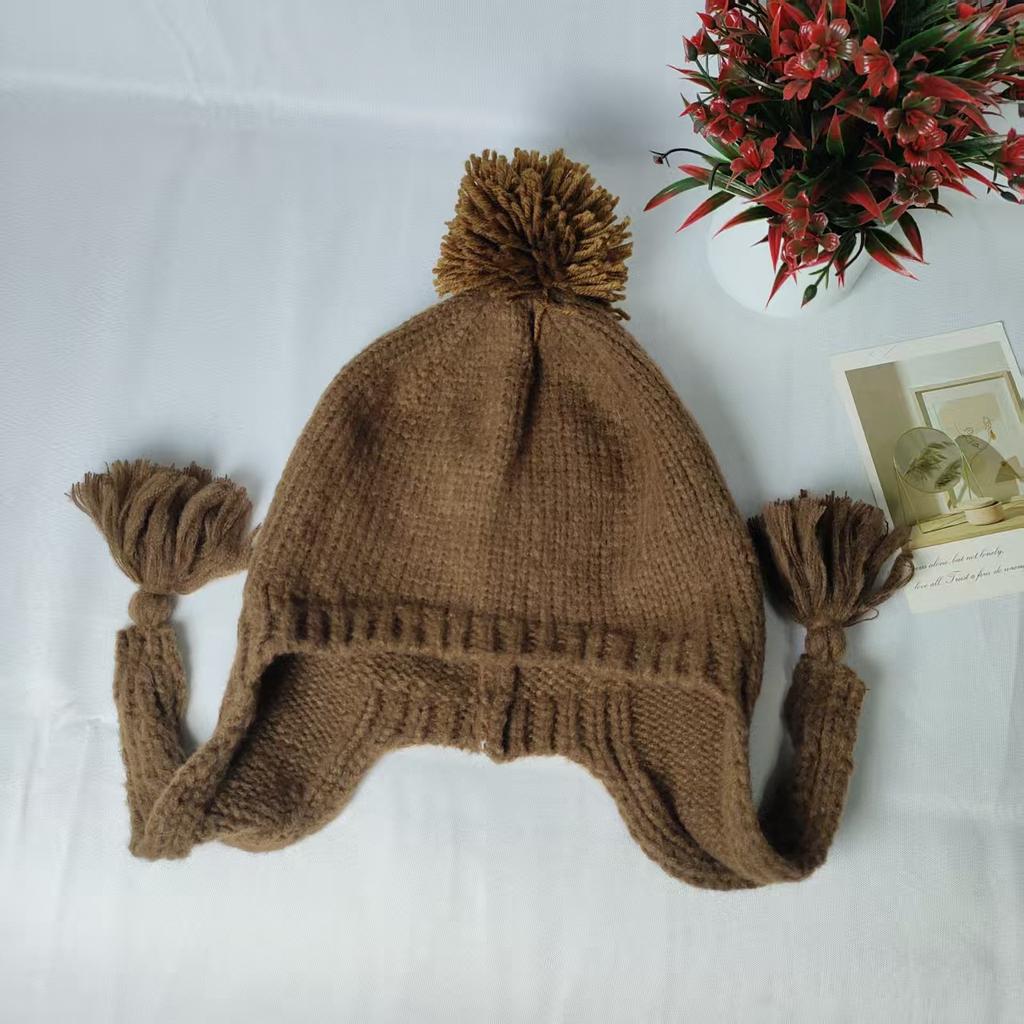 Solid color casual versatile braided hat autumn and winter cute knitted hairball hat warm and cold ear protection wool hat women