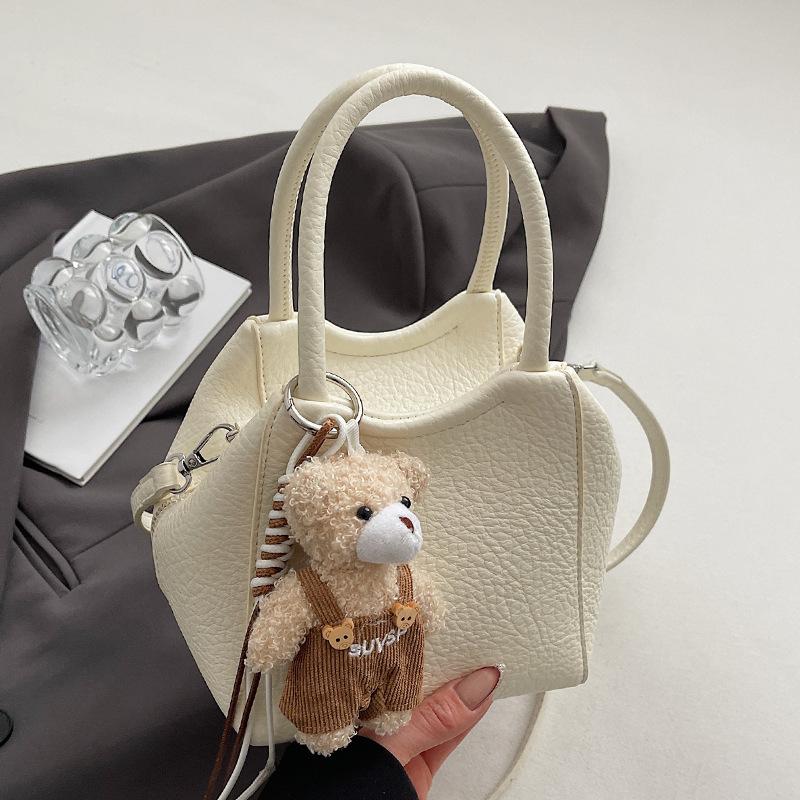 Оптовая мода высокое чувство простой стиль однотонный узор личи сумка-ведро повседневная универсальная сумка-мессенджер для通勤 для женщин