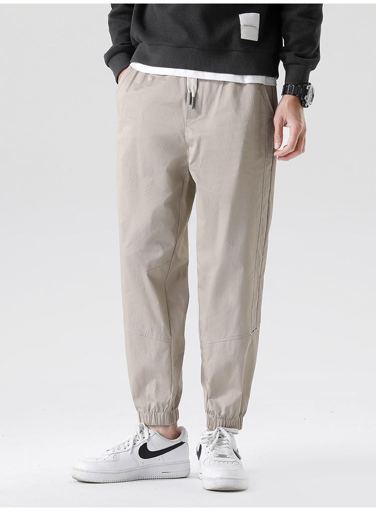 High twist wrinkle resistant cotton toe binding men's sports pants, loose tapered casual pants