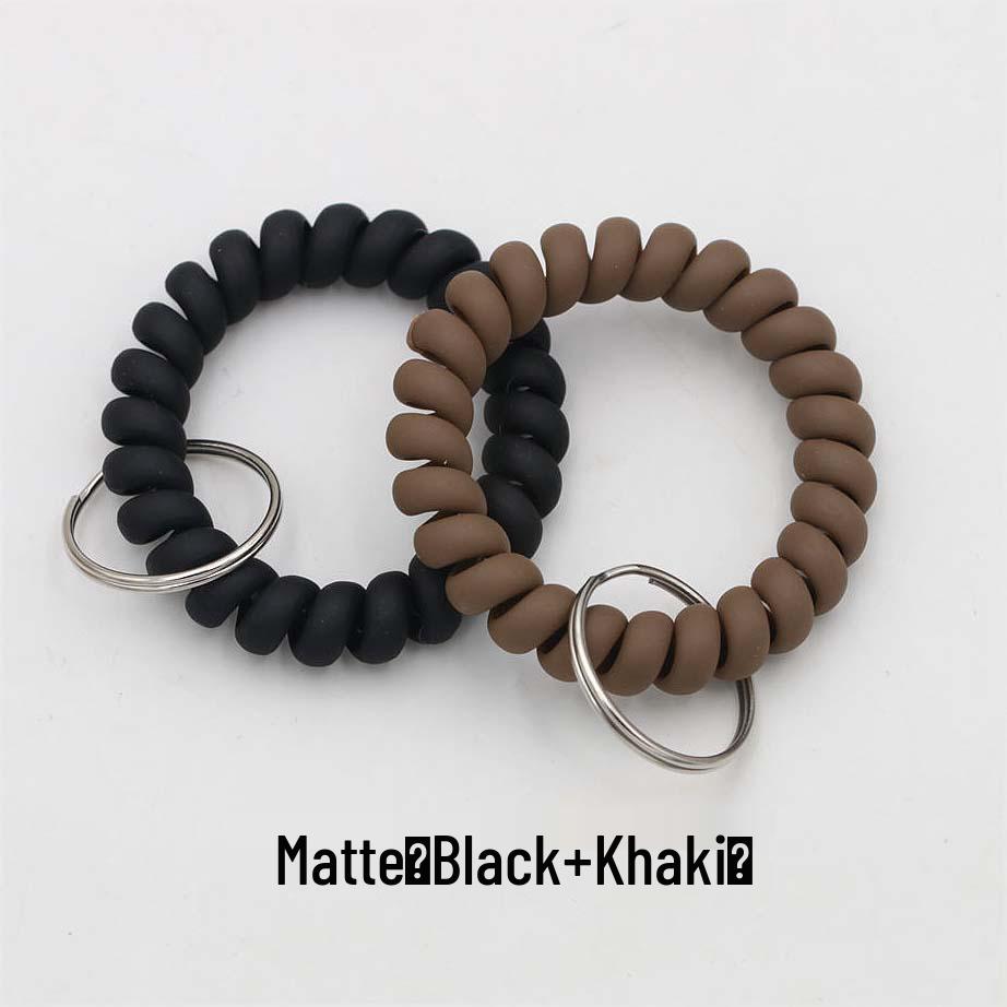 Минималистичный браслет-брелок и резинка для волос в виде пружинного механизма