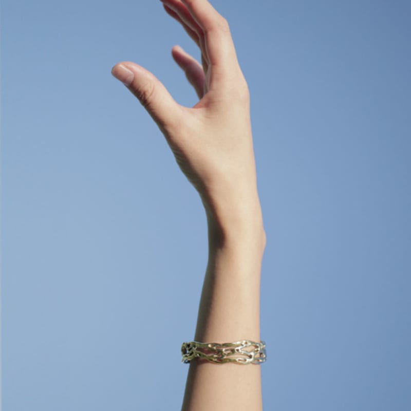 Aureola breaking wave bangle