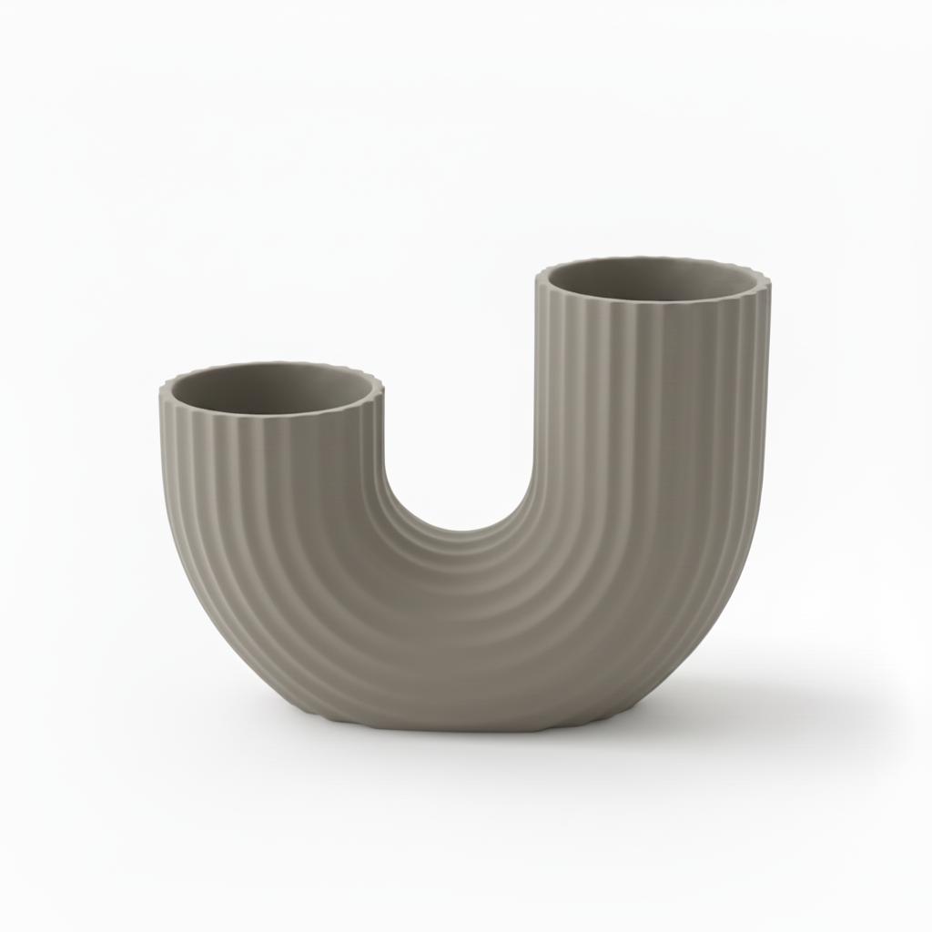 Modern, minimalist gray vase in a U-shape with an elegant form