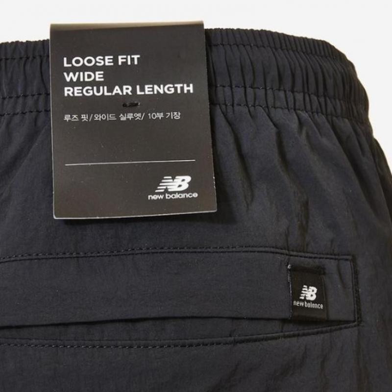 New Balance Унисекс Базовые нейлоновые брюки с логотипом Nbntc32703