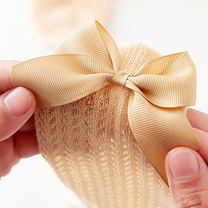 Носочки гольфы для маленькой девочки. Ткань дышащая, цвета нежные, украшены бантиком из ленты