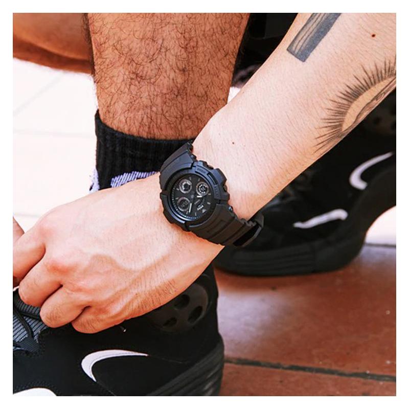 Casio Серия G-SHOCK Модный и яркий Уличная классика Стрелочный Двойной дисплей Циферблат Водонепроницаемый Механизм Кварцевый механизм Ремешок из смолы AW-591BB-1A