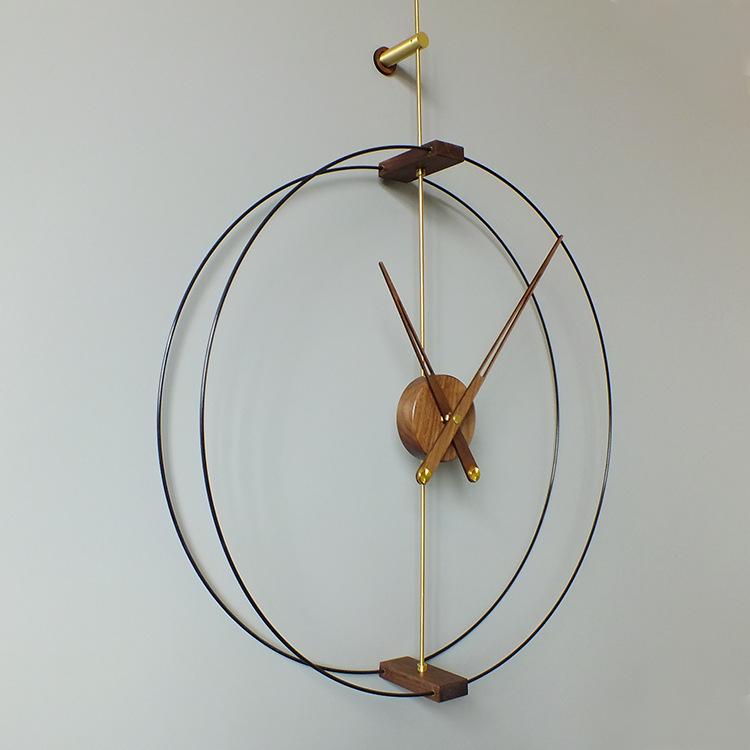 Nordic Modern Minimalist Spanish Nomon Wall Clock, Black Walnut with Large Copper Pointer for Hotel and Living Room Decor.