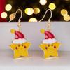 Beautiful star-shaped earrings wearing a red Christmas hat, perfect for Christmas and Advent