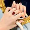 Роскошное регулируемое женское кольцо цвета граната с красной цирконией и бриллиантами микро-инкрустации