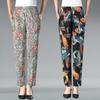 Летние брюки с цветочным принтом для женщин среднего и пожилого возраста. Эластичные брюки с высокой талией и цветочным принтом больших размеров для женщин среднего возраста.