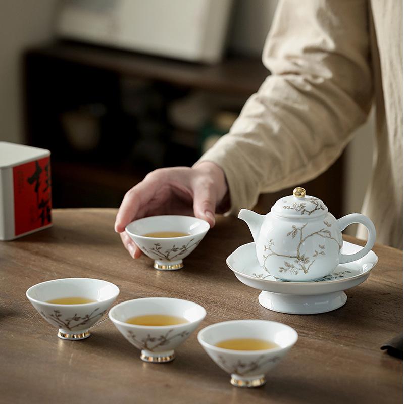 Suet white jade porcelain gold-painted household cover bowl Kung Fu tea set small set teapot teacup Jingdezhen high-end gift box