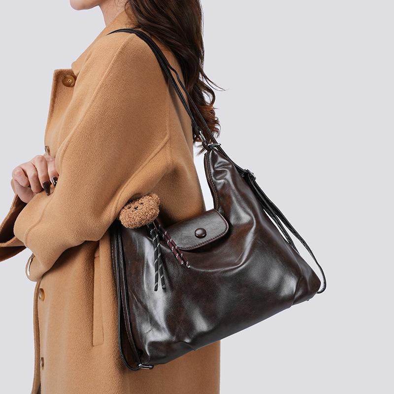 Retro soft leather backpack women's 2026 new versatile casual messenger bag large capacity class tote bag