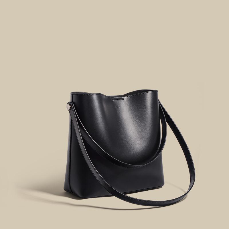 Новая кожаная модная нишевая дизайнерская сумочка, коровья кожа, большая вместимость, сумка-ведро через плечо для通勤