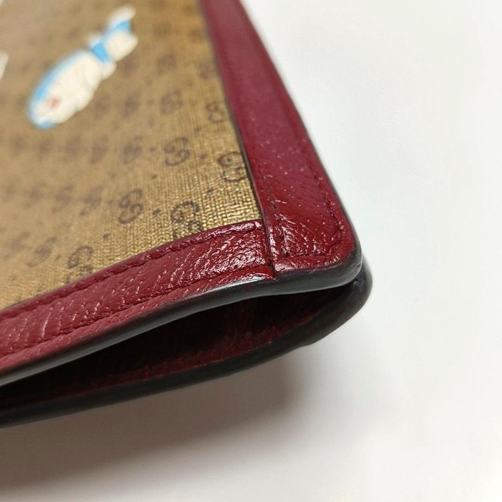 [Pre-Owned] X Doraemon Collaboration Monogram Logo Canvas And Leather Clutch - Good #1HAOK50