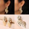 Metal Leaf Earrings With Gold Coating And Bold Design For Holidays And Events
