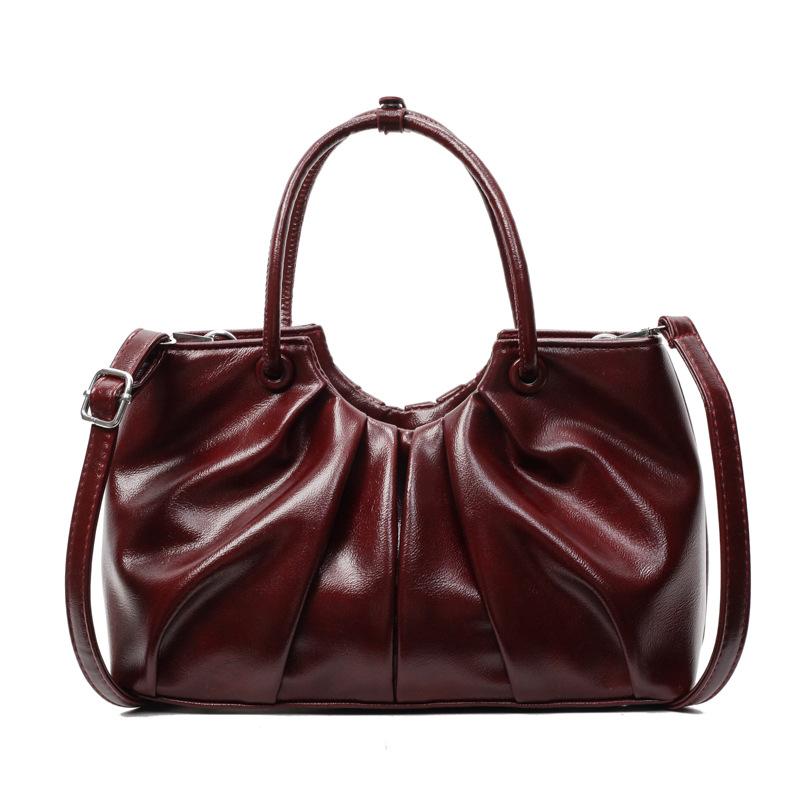 Корейская версия нишевой дизайнерской плиссированной сумки в иностранном стиле, женская универсальная сумка-мессенджер для通勤 из масляной вощеной кожи с чувством стиля