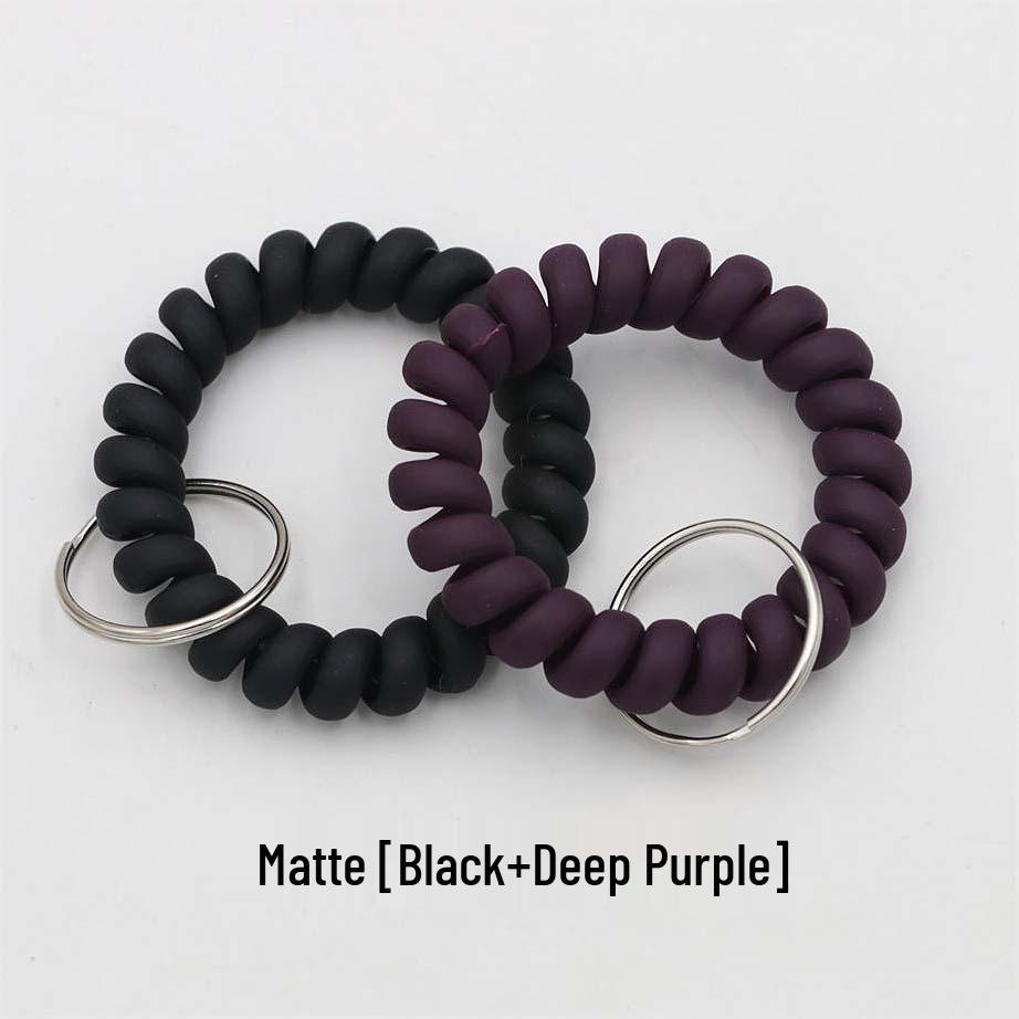 Минималистичный браслет-брелок и резинка для волос в виде пружинного механизма