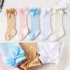 Носочки гольфы для маленькой девочки. Ткань дышащая, цвета нежные, украшены бантиком из ленты