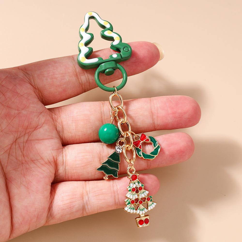 Festive Keychain: Christmas Jewelry with Santa, Snowman, Tree, and Candy-themed Pendant