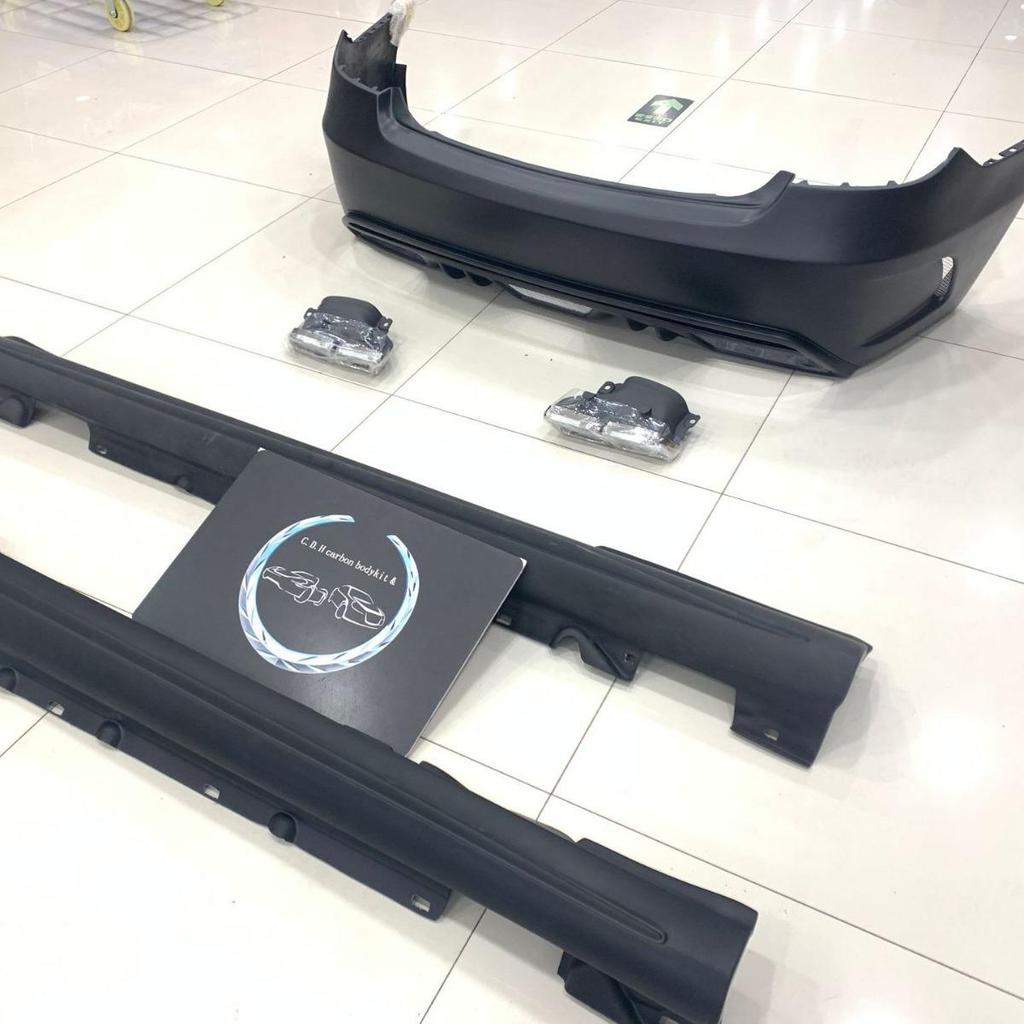 PD Style Body Kit for E-Class W207: Front Bumper, Rear Bumper, Side Skirts, Tailpipes.