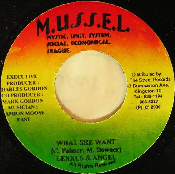 7-дюймовая пластинка LEXXUS & D'ANGEL / WE-KEN - What She Want / Come Out To Play NONE M.U.S.S.E.L. 2001 Ямайка, использовано регги, ска и даб