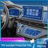 Комплект защитных и декоративных пленок для интерьера Honda Odyssey: Включает пленку для фар, центральную консоль, экран навигации, аксессуары для рычага переключения передач.