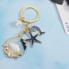 Брелок с жемчугом и дельфином, модные подвески на морском пляже, новый брелок с ракушкой и звездой унисекс