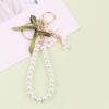 Металлический брелок с цветком, подвеска из искусственной жемчужной ленты, декор в виде банта, автомобильный брелок для ключей, сумка для наушников, аксессуары для телефонов