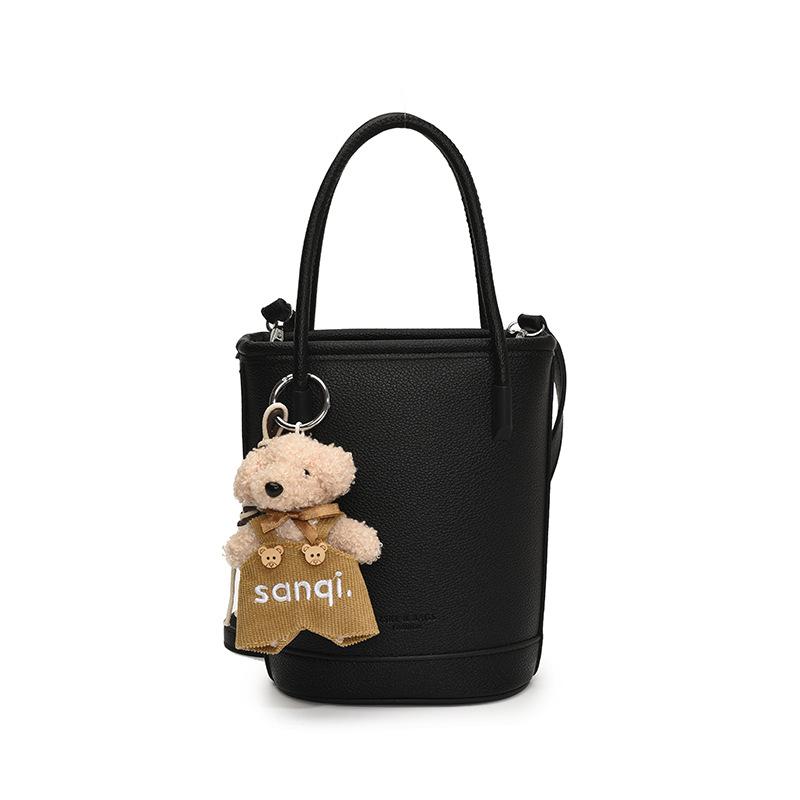 Оптовая продажа новых нишевых простых однотонных сумок-ведер с текстурой «личи», для ношения в руке, универсальных, в зарубежном стиле, для поездок на работу, мессенджеров, женских сумок