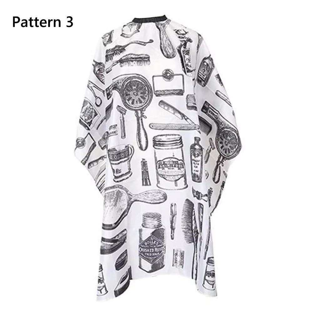 Прочная пряжка Ткань для стрижки волос Салонный аксессуар Антистатический парикмахерский пеньюар Черный/С рисунком расчески Парикмахерский халат Парикмахерское дело