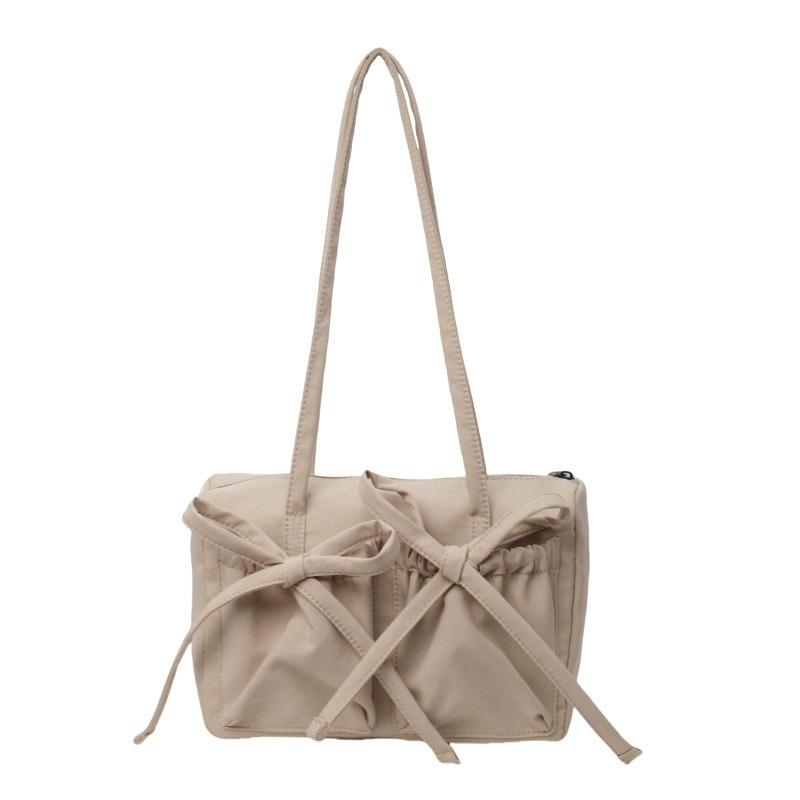 Новая сумка-тоут с бантом, высококлассная, вместительная сумка на плечо, женская простая однотонная сумка для通勤, сумка под мышкой