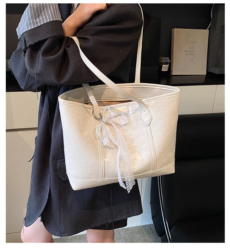 Женская сумка-тоут для студенток выпуск 2025 новый рюкзак большой вместимости повседневная сумка на плечо летняя корейская сумка для поездок на работу