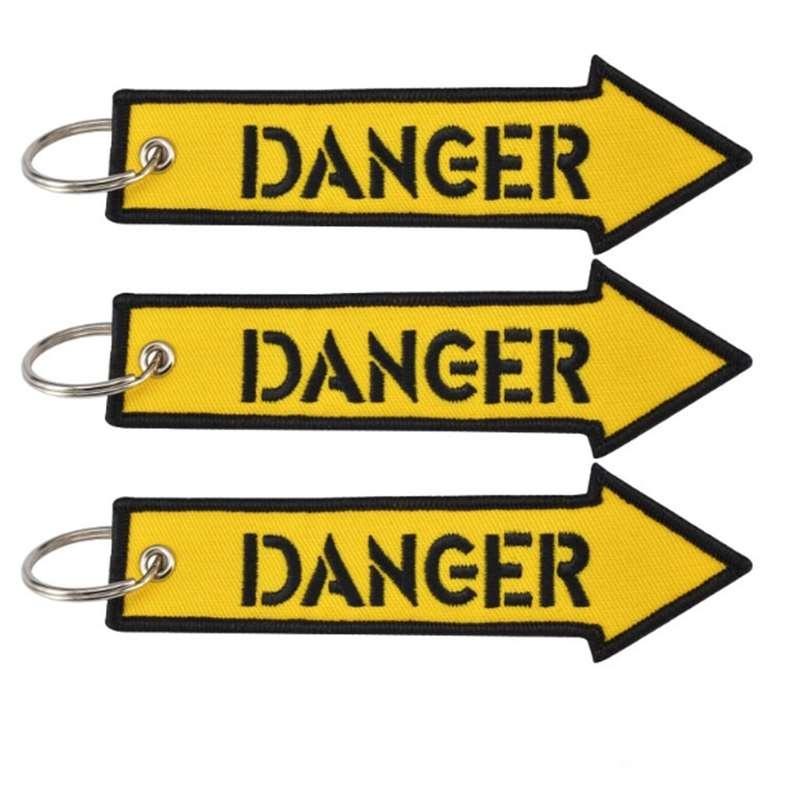 Удалите перед полетом желтый брелок с вышивкой в ​​виде буквы опасности, ремешок для ключей, брелок