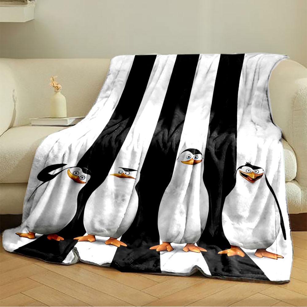 Four cartoon penguins stand against vertical black-and-white stripes. for all seasons blanket lunch break throw gift