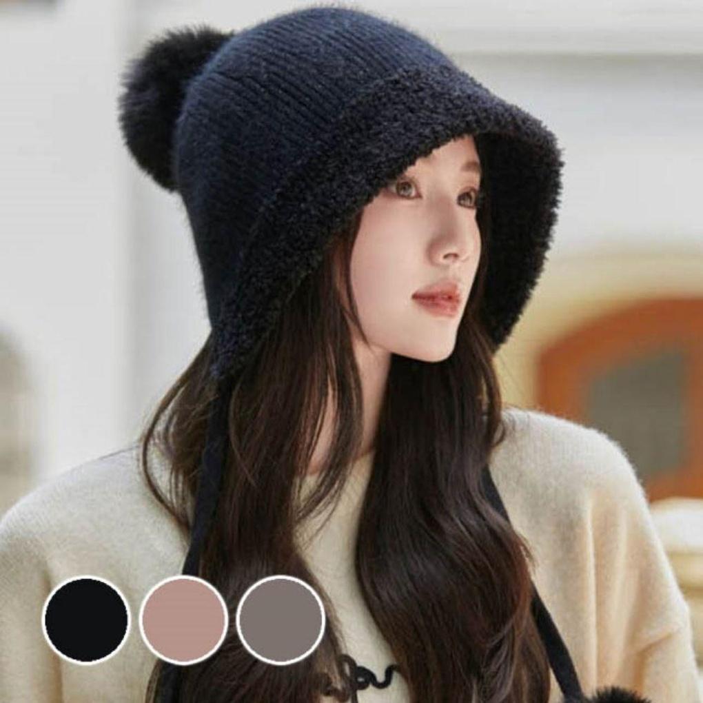 Cute and warm winter hat with a big drop of knitted wool