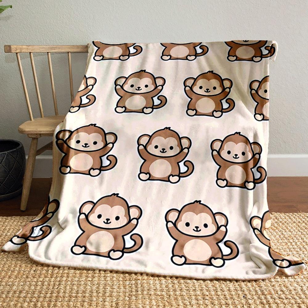 Cartoon monkeys with raised arms repeated on a beige background. for all seasons blanket lunch break throw gift