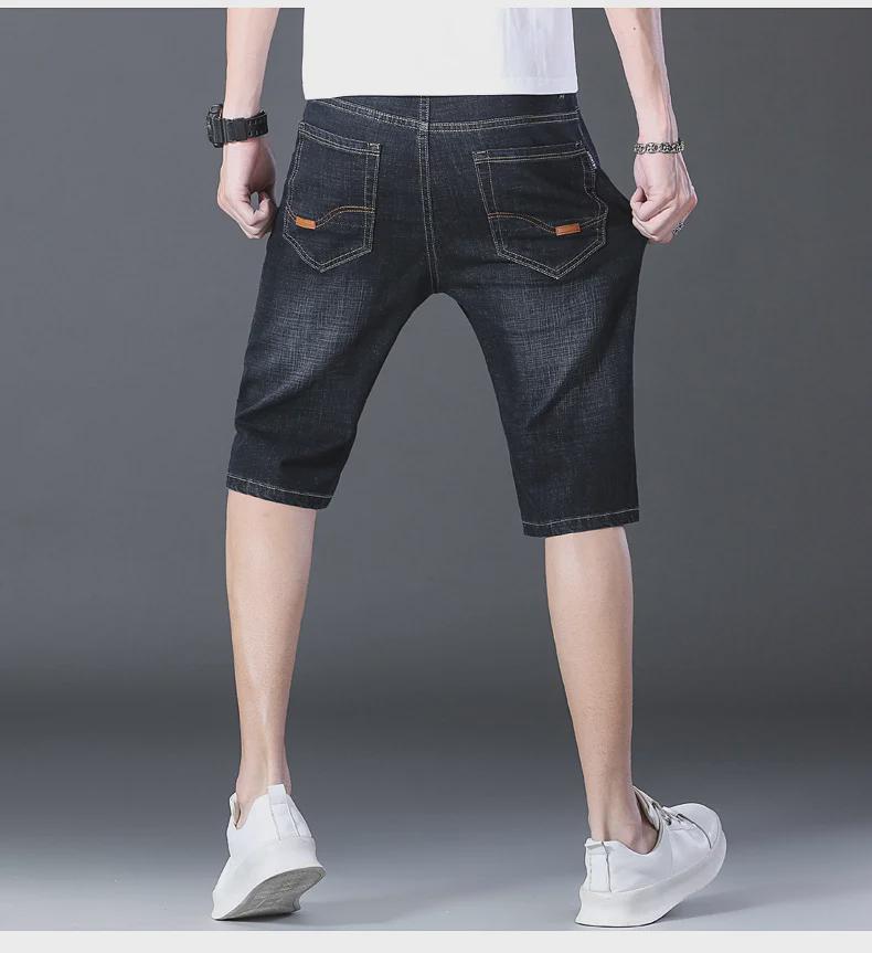 Popular Men's Cropped Four-Season Trousers: Elastic, Mid-Waist, and Trendy 7-Point Regular Denim for Youthful Style